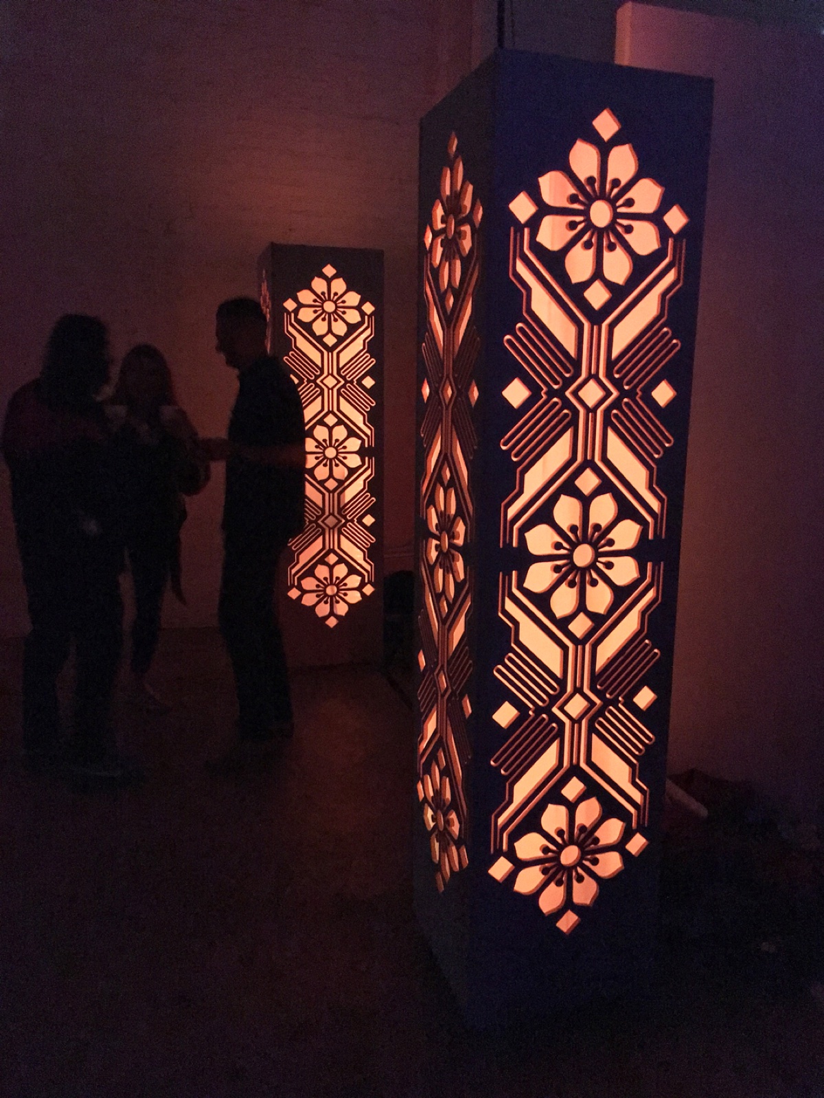 Playa Pillars lit in a dark room